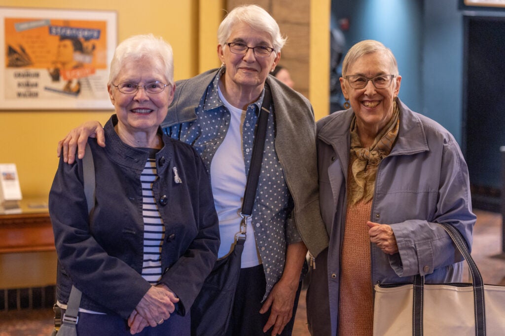 Friends Carole Green (left), Lucrecia Herr (center) and Kenna Adatte (right) pose for a photo at the theater