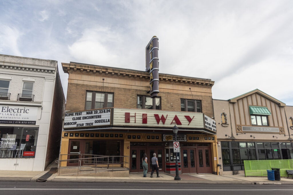 A sign reads "Hiway" on the exterior of the Hiway Theater in Jenkintown