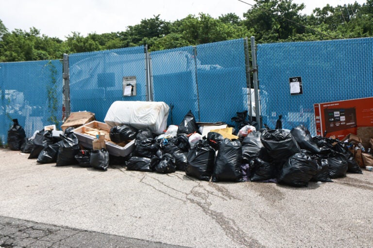 Trash bags piled up outside the Northwest Sanitation Convenience Center