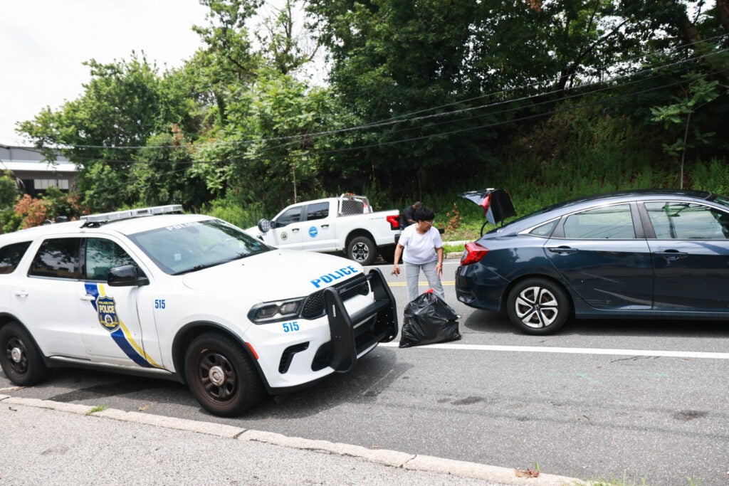 Police parked outside the Northwest Sanitation Convenience Center in Philadelphia