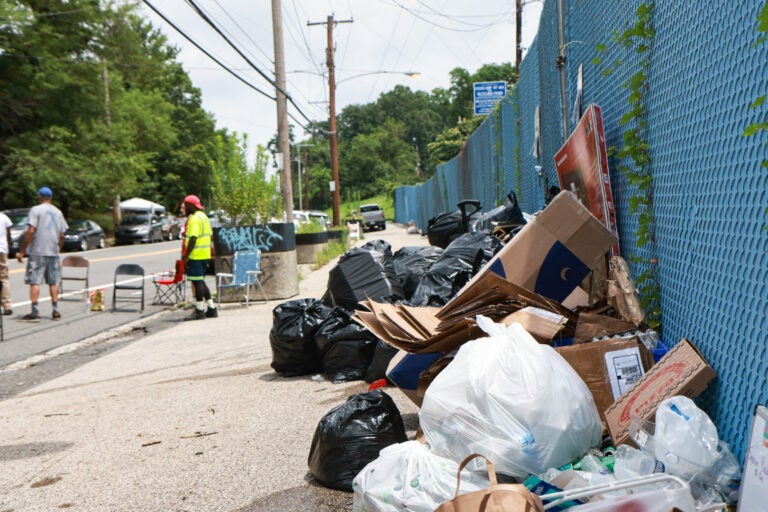 bags of trash outside the Northwest Sanitation Convenience Center