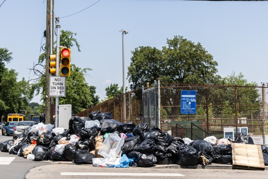 A pile of trash bags at Piccoli Playground