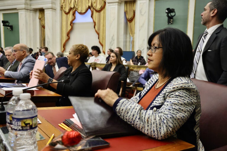Philadelphia City Councilmember Nina Ahmad seated at her desk in City Council chambers at City Hall