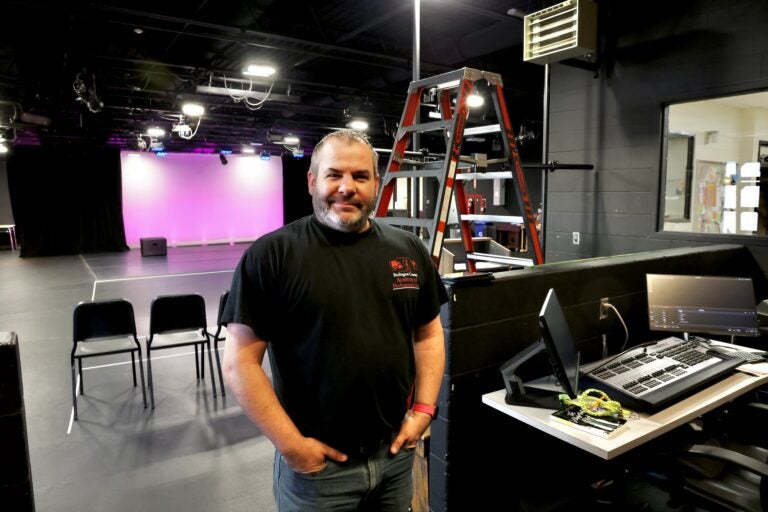 Scott Cooney poses for a photo in the theater