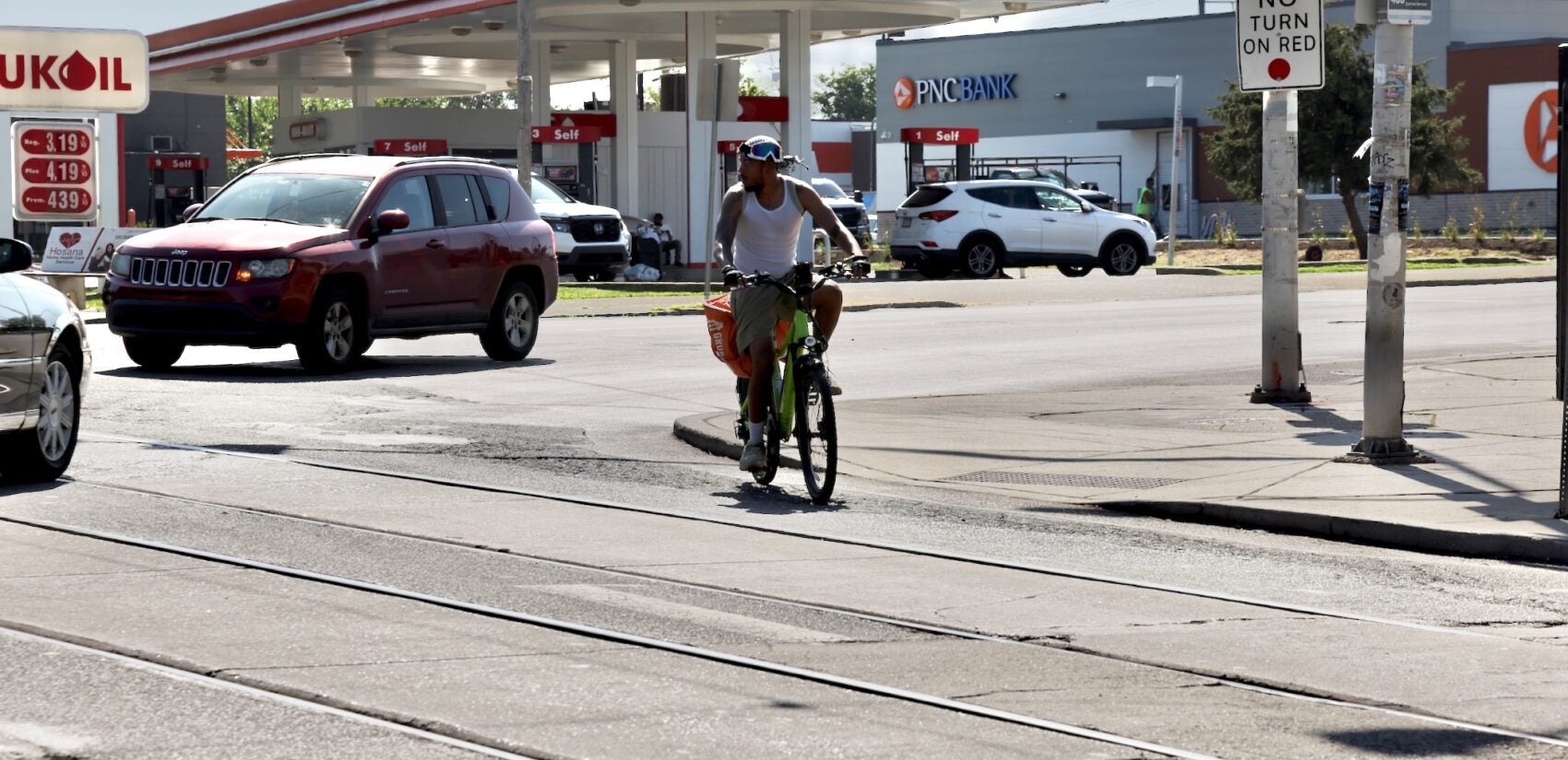 A cyclist warily negotiates the intersection of Baltimore Avenue and 58th Street