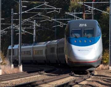 In this Oct. 18, 2016 file photo, an Amtrak Acela train travels through Old Lyme, Conn. On Friday, Dec. 16 federal railroad regulators endorsed an ambitious and costly plan to rebuild the congested Northeast Corridor over the next 30 years. The plan recommends a tunnel through Old Lyme after residents complained about the prospect of elevated tracks. (AP Photo/Michael Dwyer)
