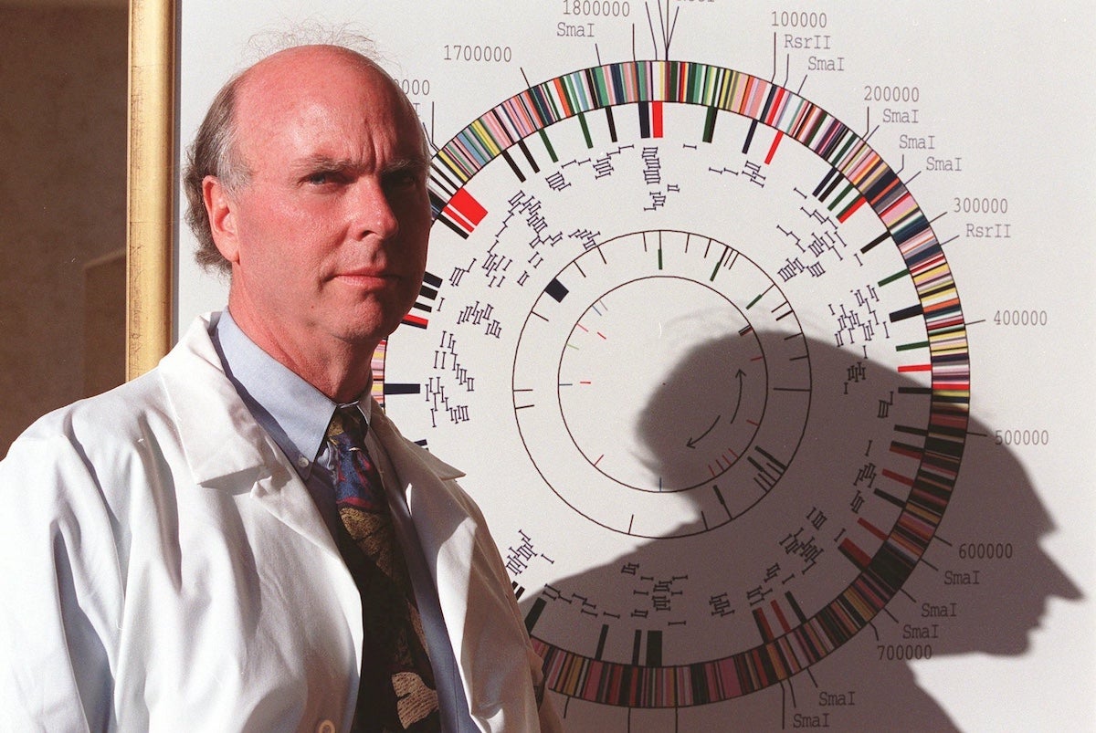 J. Craig Venter poses before a gene map of a flu-causing bacterium in his Rockville, Md., office, March 12, 1997. (AP file Photo/Ruth Fremson)
