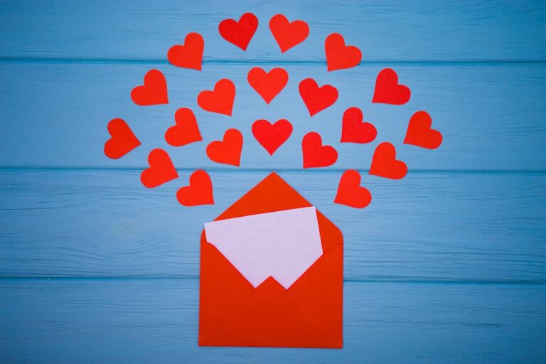 Red hearts emerging from a red envelope. (Bigstock Image)