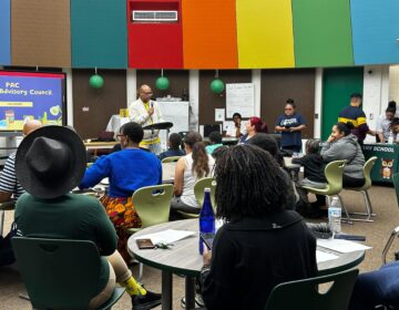 Parents and students build a library at Forest Hill family school in Camden New Jersey to discuss district cuts to fill a $91 million deficit.