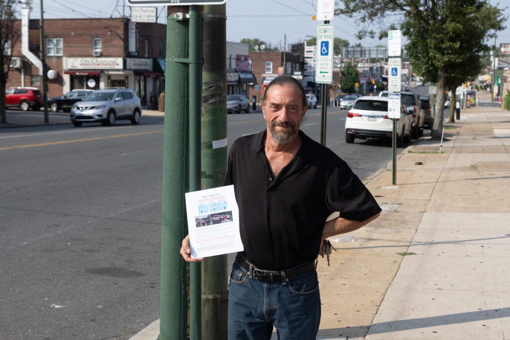 Robert Rudinsky standing on sidewalk on Castor Avenue