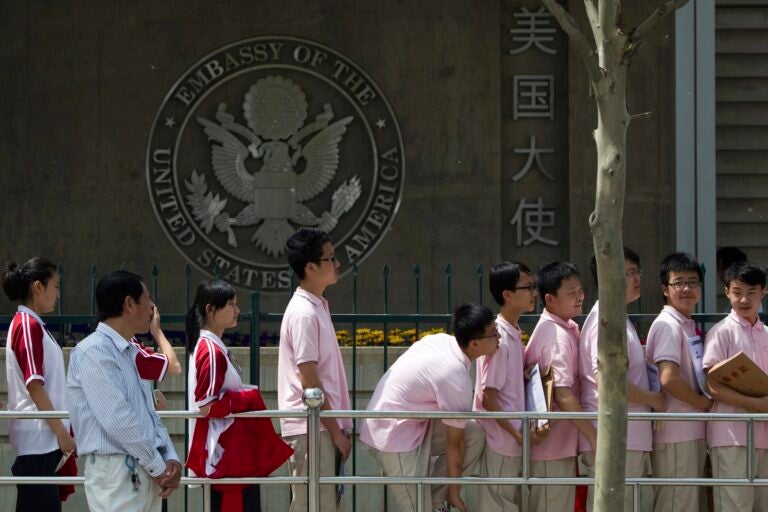 Students waiting in line in front of the Embassy