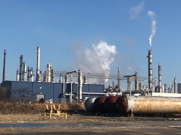 Smoke billowing from the oil refinery