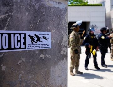 DHS police and National Guard protect the outside the Metropolitan Detention Center in Los Angeles