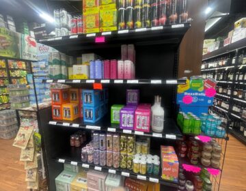 Several rows of beverages on display in the store