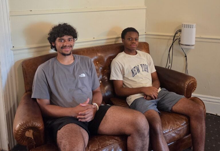 Meno Dwyer and Seth Akuaku sit and smile