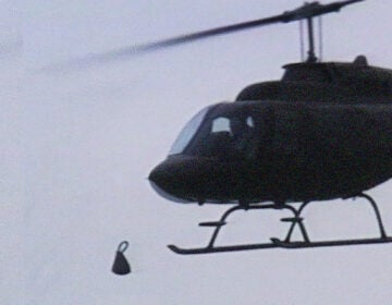 a helicopter drops a bomb