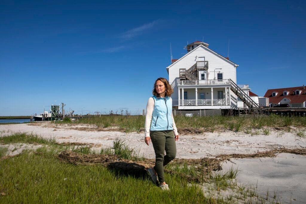 A woman walking along the beach