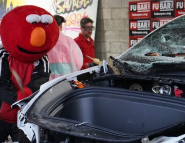 Philly Elmo whacks Tesla
