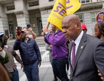 Mayor Ras Baraka arrives to speak to supporters and media after a court appearance in Newark