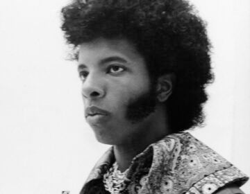 A closeup photo of a young Sly Stone
