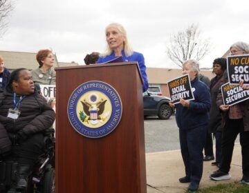 Mary Gay Scanlon speaks behind a podium