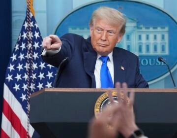 Donald Trump pointing to a reporter during a press conference