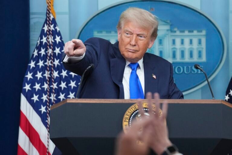 Donald Trump pointing to a reporter during a press conference