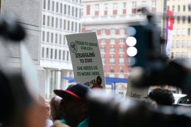 Union members and supporters marched around City Hall
