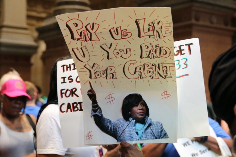 Union members and supporters marched around City Hall