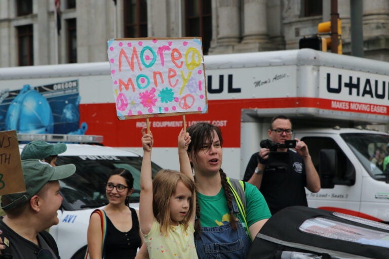 Union members and supporters marched around City Hall
