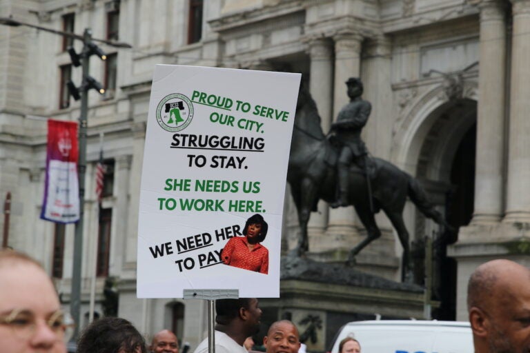 Union members and supporters marched around City Hall