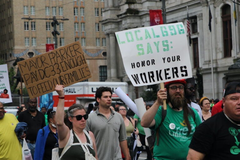 Union members and supporters marched around City Hall