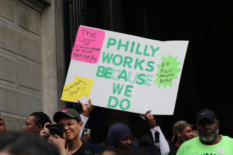 Union members and supporters marched around City Hall