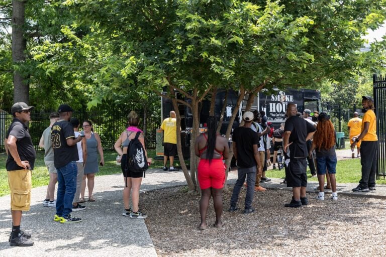 Community members line up for BBQ
