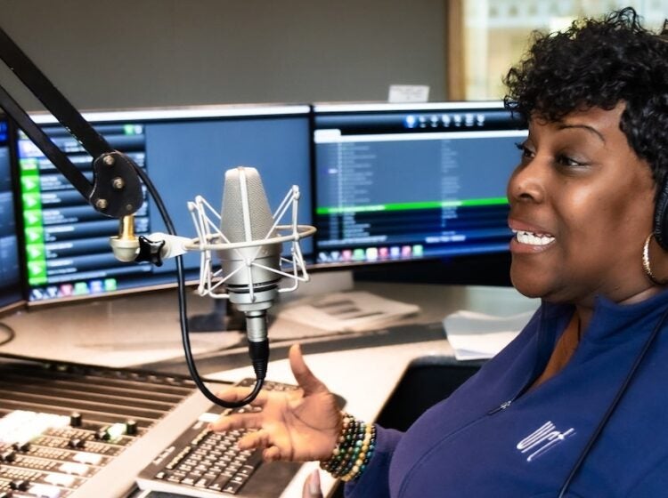 Nicole Sweeney on the mic at the station’s studio